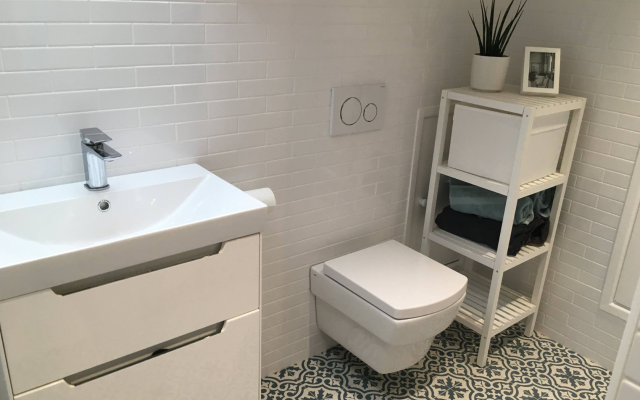 White bathroom with modern patterned floor tiles